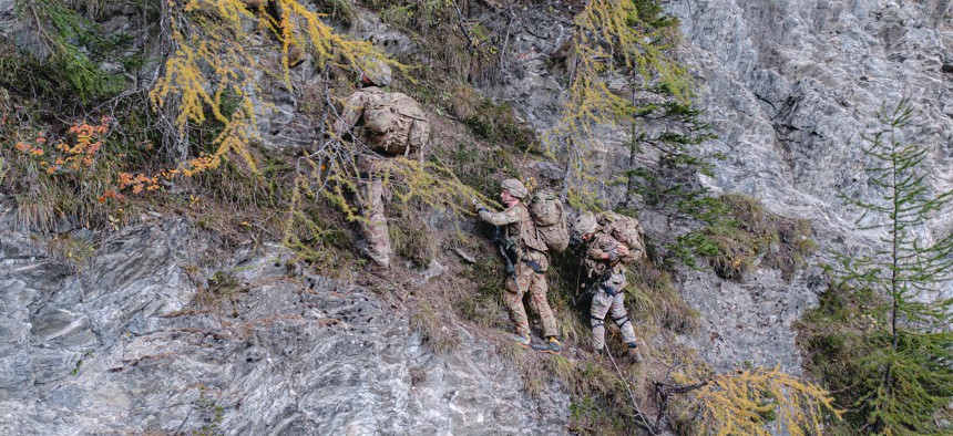 U.S. Army paratroopers assigned to 1st Battalion, 503rd Parachute Infantry Regiment alongside Italian Alpini Soldiers climb up a vertical obstacle during air assault training at Exercise Alpine Star 22 in Prato Piazza, Italy, October 12, 2021.