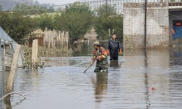Villagers wade into floods caused by heavy rains in Liangdu township on October 11, 2021, in the Shanxi Province of China.