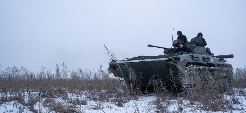 Members of Ukraine's Mechanized Brigade drive vehicles in Luhansk Region, Ukraine on January 25, 2022.