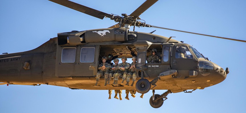 A Nov. 8, 2021, photo of soldiers participating in the annual Saint Michael's Jump, honoring the patron saint of the 82nd Airborne Division, at Fort Bragg, N.C.