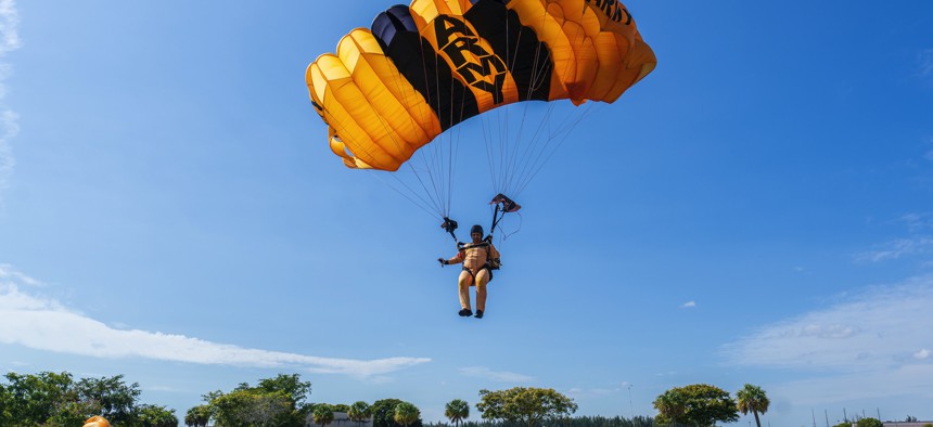 Sgt. 1st Class Dominic Perry of the U.S. Army Parachute Team lands his parachute for a training jump in Homestead, Florida on 26 Jan. 2022. 