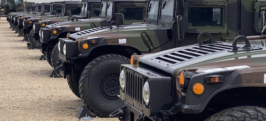 A line of Humvees at the Equipment Configuration Handling Area at Tapa Barracks, Estonia, stand ready for issue to the units participating in DEFENDER-Europe 21.