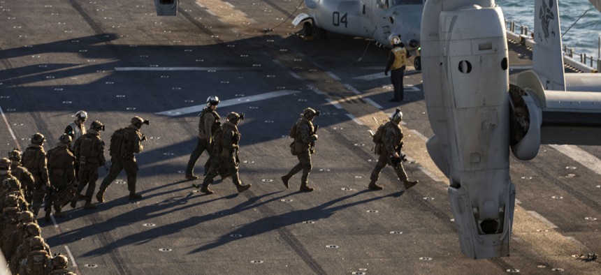 U.S. Marines with 2nd Battalion, 6th Marine Regiment, board an MV-22 Osprey during Composite Training Unit Exercise aboard the amphibious assault ship USS Kearsarge, Jan. 27, 2022. 