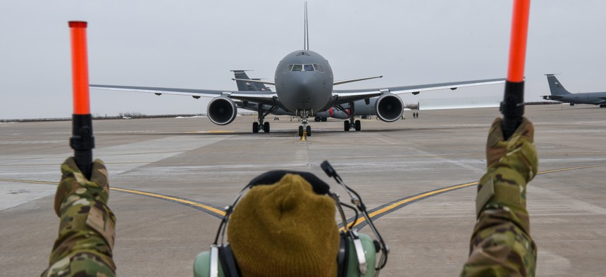 Master Sgt. Arenda Jackson, 931st Aircraft Maintenance Squadron crew chief, marshals the KC-46A Pegasus on the flightline Feb. 21, 2019, at McConnell Air Force Base Kan. 