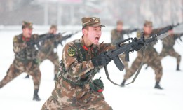 Armed police officers and soldiers train in the snow on January 27, 2022, in Pingliang, Gansu Province of China.