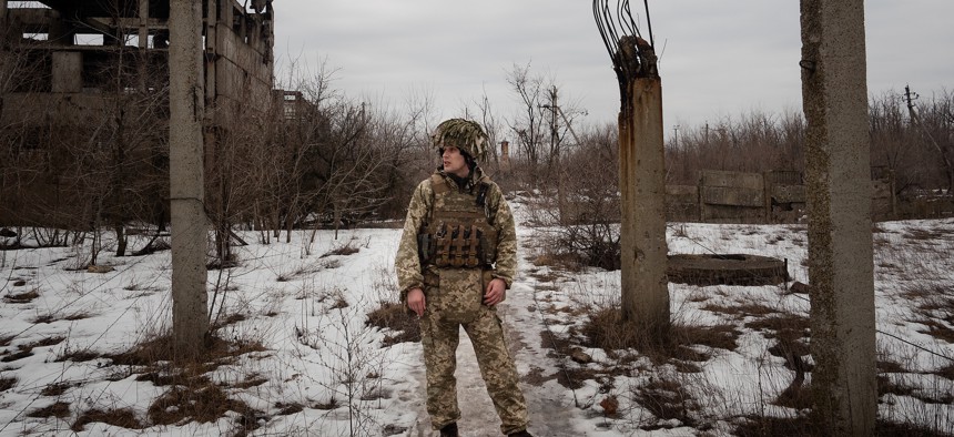 An Ukrainian soldier of the 25th Airborne stands in a military position near Donetsk, on February 11, 2022 in Donetsk, Ukraine. 