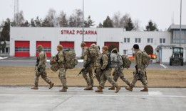Paratroopers from the 82nd Airborne Division make their way to the terminal after arriving on a C-17 Globemaster aircraft at Rzeszów-Jasionka Airport, Poland Feb. 6. 