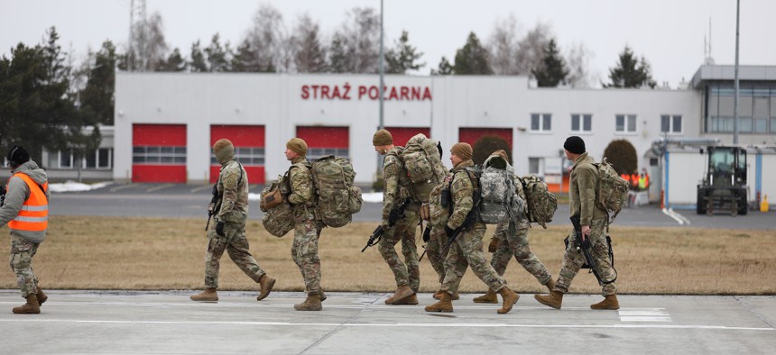 Paratroopers from the 82nd Airborne Division make their way to the terminal after arriving on a C-17 Globemaster aircraft at Rzeszów-Jasionka Airport, Poland Feb. 6. 