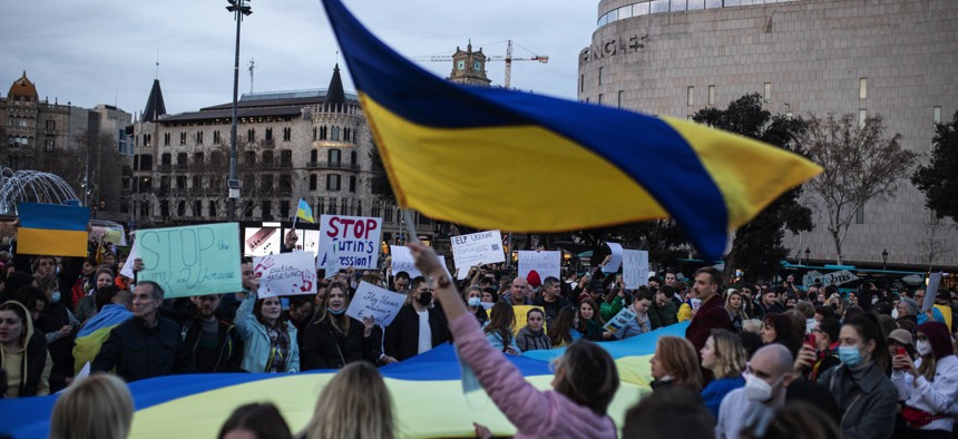Protestors denounce Russia's invasion of Ukraine on February 24, 2022, in Barcelona, Spain.