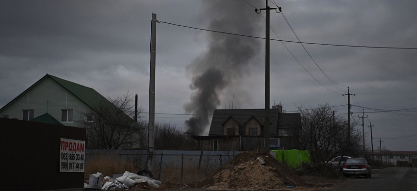 Smoke rises near the Ukrainian town of Hostomel and the Antonov Airport, in northwest Kyiv on February 24, 2022. Russian forces are trying to seize an airbase on the capital's northern outskirts, a senior Ukrainian officer said.