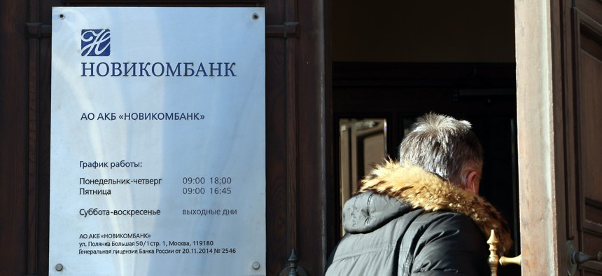 A man enters an office of Novikombank in Moscow.