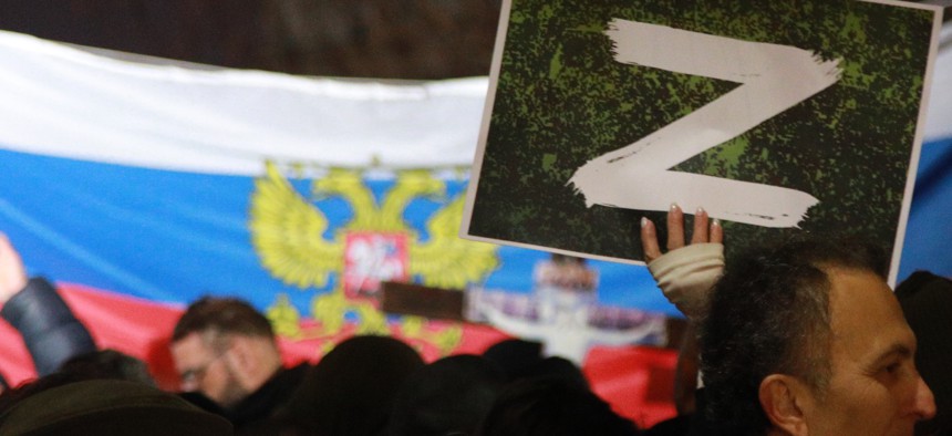 A protester holds a "Z" sign during a rally organized by Serbian right-wing organizations in support of Russian attacks on Ukraine, in Belgrade, March 4, 2022. 