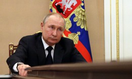 Russian President Vladimir Putin chairs a meeting with members of the Russian government via teleconference in Moscow on March 10, 2022. 