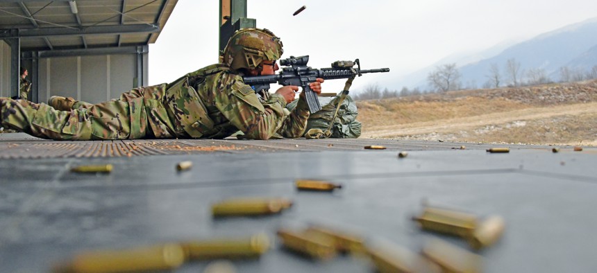 A U.S. Army paratrooper engages a pop-up target during marksmanship training at Cao Malnisio Range, Pordenone, Italy, March 15, 2022.