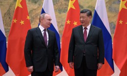 Russian President Vladimir Putin (L) and Chinese President Xi Jinping pose during their meeting in Beijing, on February 4, 2022. 