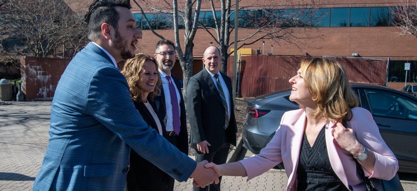 Deputy Secretary of Defense Kathleen H. Hicks greets Strategic Capabilities Office staff after arriving for a tour of their facilities at Chantilly, Va., March 11, 2022. 