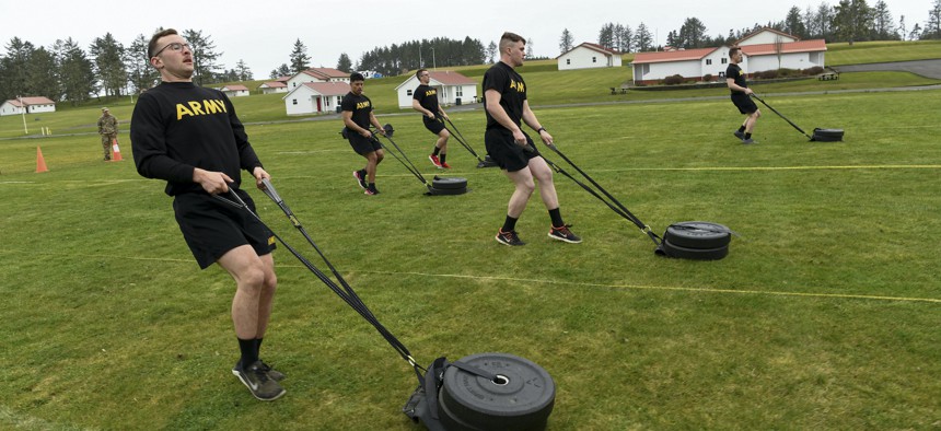 Oregon Army National Guard Spc. Wyatt Walls (left) takes part in the Army Combat Fitness Test (ACFT) during the 2022 Best Warrior Competition, March 17, at Camp Rilea near Warrenton, Ore.