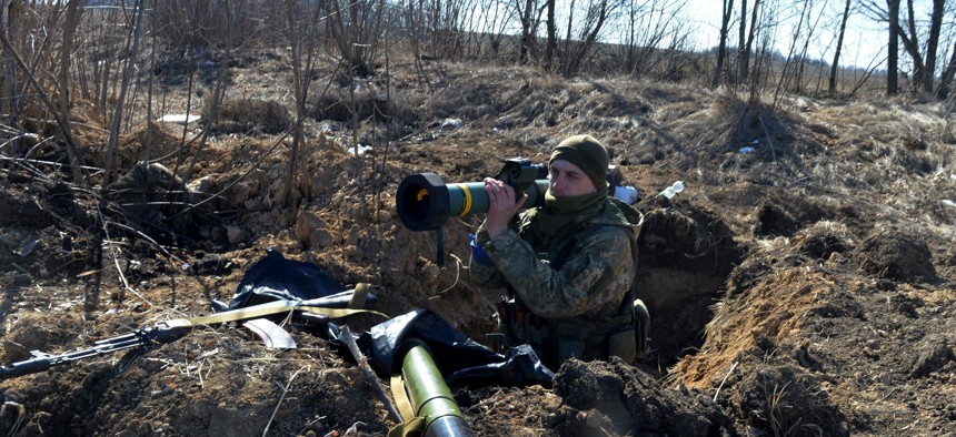 A Ukrainian soldier holds a FGM-148 Javelin, an American-made anti-tank missile, at a checkpoint near Kharkiv on March 23, 2022.