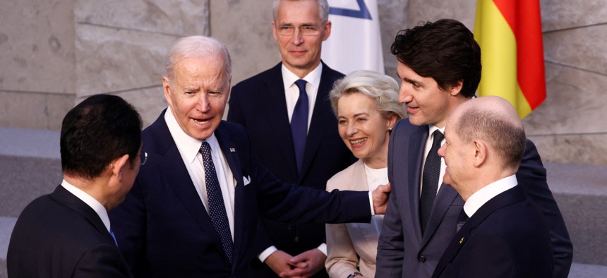  (L-R) Japan's Prime Minister Fumio Kishida, U.S. President Joe Biden, NATO Secretary General Jens Stoltenberg, European Commission President Ursula von der Leyen and Canada's Prime Minister Justin Trudeau and Germany's Chancellor Olaf Scholz before G7 leaders' family photo during a NATO summit on Russia's invasion of Ukraine, at the alliance's headquarters in Brussels, on March 24, 2022 in Brussels, Belgium. 