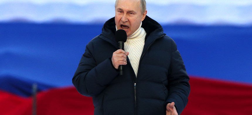 Russian leader Vladimir Putin speaks at a concert in Moscow to mark the anniversary of the annexation of Crimea, on March 18, 2022. 