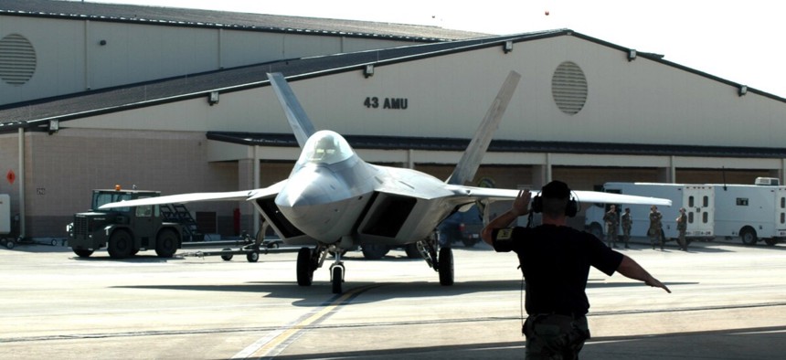 The Air Force is asking to retire 33 F-22 jets used for training, like this one shown arriving at Tyndall Air Force Base, Fla., in 2006.