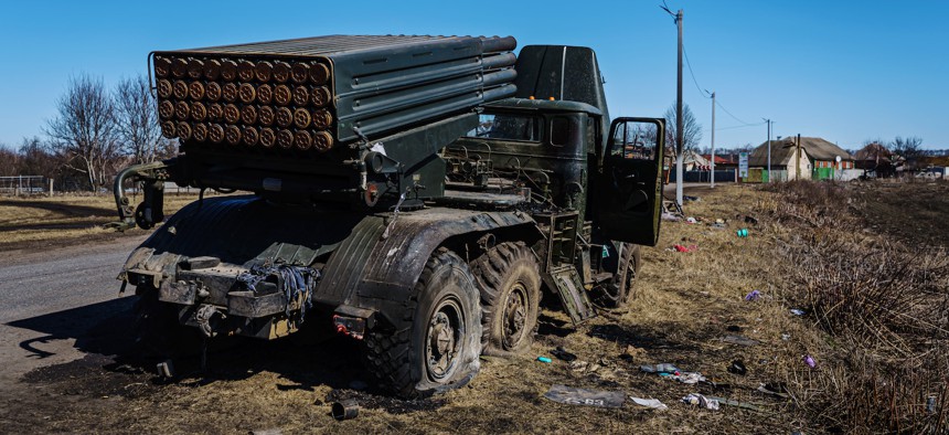An abandoned Russian rocket launcher sits abandoned on the site of the road, in Prudyanka, Ukraine, Tuesday, March 22, 2022