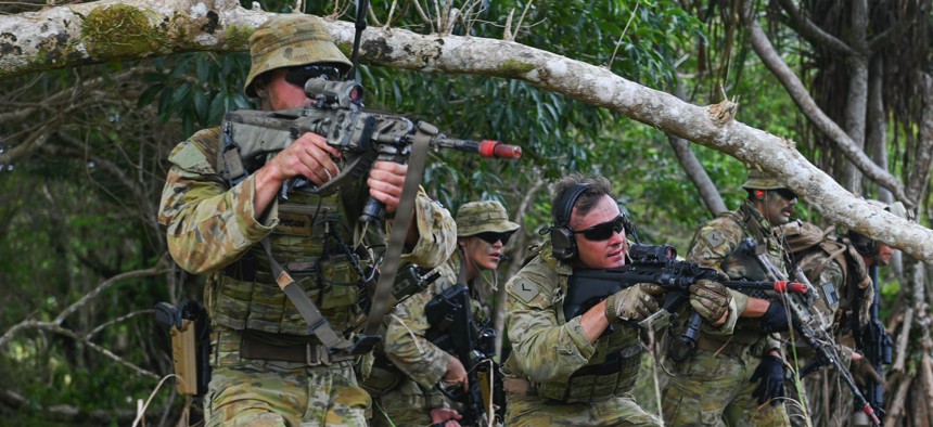 The Royal Australian Air Force’s Airfield Defense Guards demonstrate urban combat scenarios during Pacific Defender 22-1 at Andersen Air Force Base, Guam, Feb. 1, 2022.