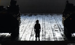 Boatswain's Mate 2nd Class Anthony Crowder prepares to direct vehicles into the well deck of amphibious transport ship USS San Diego (LPD 22) during the final amphibious assault of Rim of the Pacific 2016.
