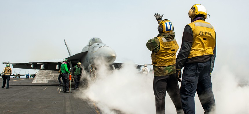 Sailors direct the pilot of an F/A-18E Super Hornet attached to the “Blue Blasters” of Strike Fighter Squadron (VFA) 34 on the flight deck of the Nimitz-class aircraft carrier USS Harry S. Truman (CVN 75) in the Adriatic Sea, April 6, 2022. 
