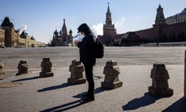 A man uses his mobile phone on Red Square in downtown Moscow.