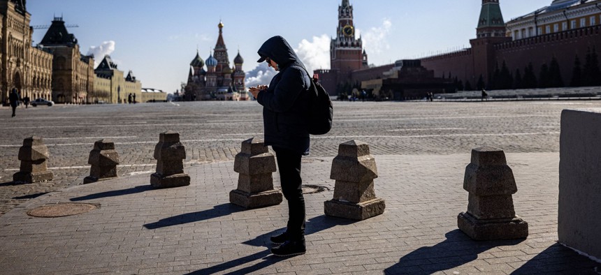A man uses his mobile phone on Red Square in downtown Moscow.