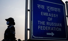 A policewoman stands guard near the Russian embassy in anticipation of a demonstration called to stop the Russian invasion of Ukraine in New Delhi on February 25, 2022.