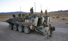 U.S. Marines with Co. D, 3rd Assault Amphibian Battalion and 2nd Battalion, 7th Marine Regiment, 1st Marine Division begin unloading an Amphibious Combat Vehicle (ACV) at the start of Marine Air Ground Task Force Warfighting Exercise (MWX) 2-21 at Marine Corps Air Ground Combat Center, Twentynine Palms, Calif., Feb. 14, 2021. 