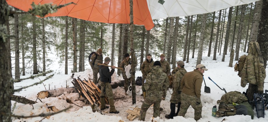 U.S. Air Force Airmen from the 352d Special Operations Wing work with 352d Special Operations Support Squadron and 100th Air Refueling Wing Survival, Evasion, Resistance and Escape specialist, during cold environment survival training in Norway, March 6, 2022.