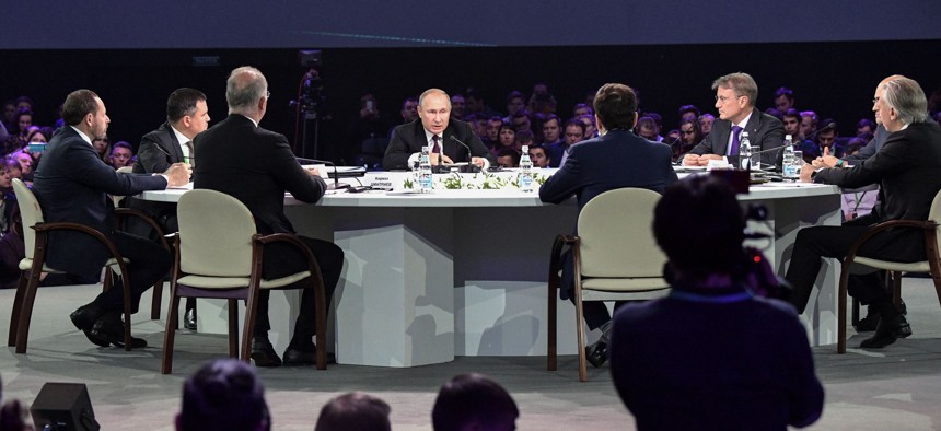Russian President Vladimir Putin speaks during a panel discussion as part of the Artificial Intelligence Journey forum, in Moscow on November 9, 2019. 