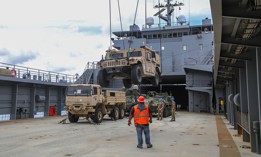 The crew of U.S. Army Vessel Lt. General William B. Bunker (LSV-4) loads equipment and supplies on LSV-4 in Guam in July 2021.