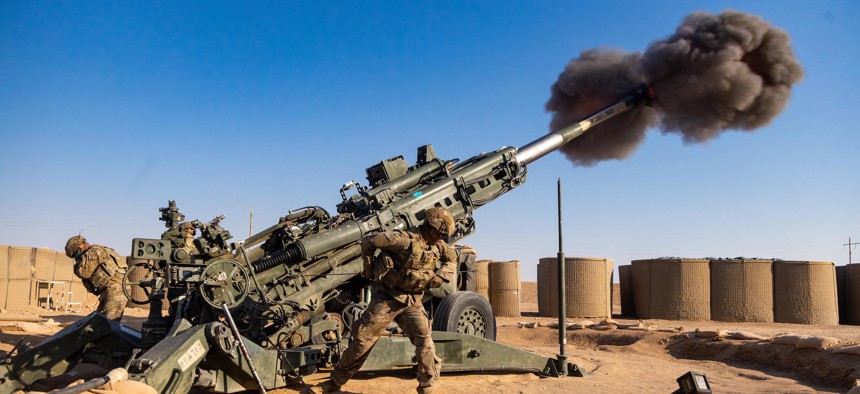 U.S. soldiers conduct registration and calibration for the M777 A2 Howitzer weapon system in Syria on Sept. 30, 2021.