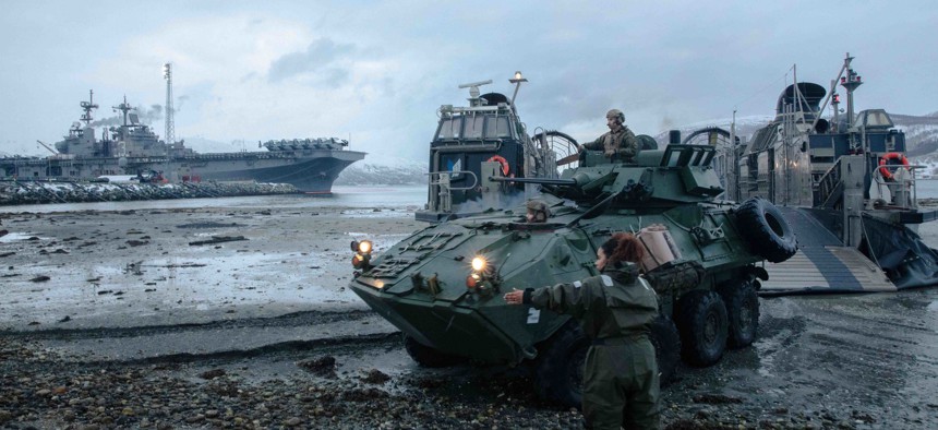 A landing craft, air cushion, attached to Assault Craft Unit 4, disembarks the Wasp-class amphibious assault ship USS Kearsarge (LHD 3), during a Marine Expeditionary Unit off-load in support of a bilateral training event in Tromsø, Norway, April 12, 2022.