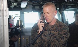 Maj. Gen. Paul J. Rock Jr., then-deputy commander of the 3rd Marine Expeditionary Force, speaks over the 1MC aboard the amphibious assault ship USS Boxer in 2019.