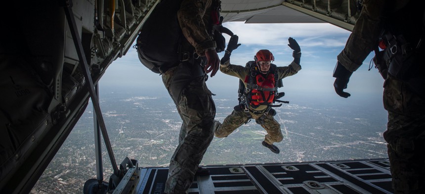A combat controller with the Kentucky Air National Guard’s 123rd Special Tactics Squadron jumps from a C-130J Super Hercules for a parachute demonstration during an airshow in Louisville, Ky., April 23, 2022.