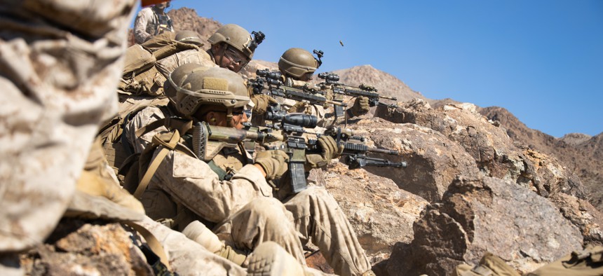 U.S. Marines with Kilo Company, 3d Battalion, 1st Marine Regiment, 1st Marine Division, provide security while conducting Range 400 as a part of Integrated Training Exercise (ITX) 3-22 at Marine Corps Air Ground Combat Center Twentynine Palms, California, April 8, 2022.
