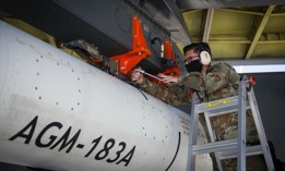 Staff Sgt. Jacob Puente secures the AGM-183A Air-launched Rapid Response Weapon Instrumented Measurement Vehicle 1 as it is loaded under the wing of a B-52H Stratofortress at Edwards Air Force Base, California, on Aug. 6, 2020.