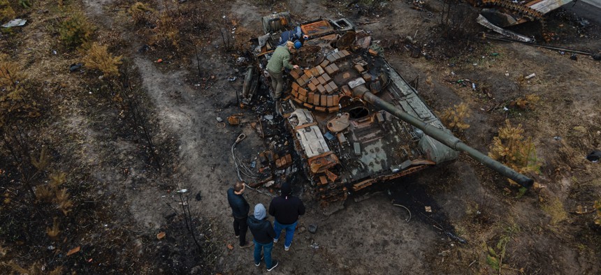 Destroyed Russian military vehicles sit by the side of a road on April 21, 2022 in Dmytrivka, Ukraine