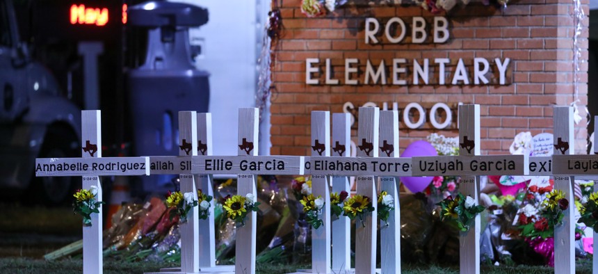 Flowers are placed on a makeshift memorial outside Robb Elementary School in Uvalde, Texas, on May 25, 2022.