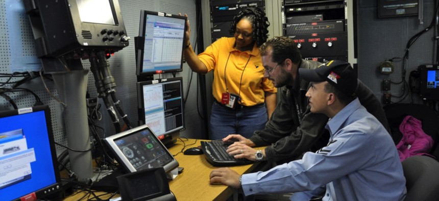 Troubleshooting the video teleconference system of a video information exchange system aboard the aircraft carrier USS Ronald Reagan in 2019.