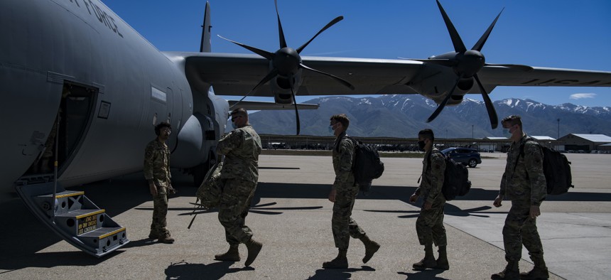 Airmen from the 366th Fighter Wing, Mountain Home Air Force Base, Idaho, board a C-130 from the 40th Airlift Squadron, Dyess Air Force Base, Texas at Hill Air Force Base, Utah, May 25, 2022 after participating in the Raging Gunfighter exercise.