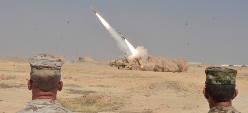 A High Mobility Artillery Rocket System strikes a building housing ISIS fighters near Haditha, Iraq, on Sept. 7, 2016. 