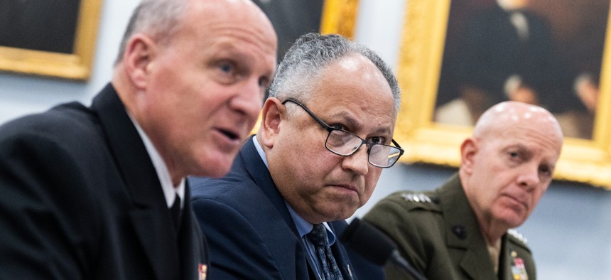 Adm. Michael M. Gilday, chief of naval operations (left), testifies alongside Navy Secretary Carlos Del Toro and Marine Corps Commandant Gen. David H. Berger at a House hearing on May 18, 2022.