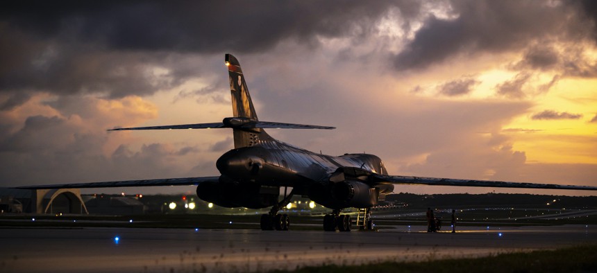 A B-1B Lancer aircraft assigned to the 34th Expeditionary Bomb Squadron, Ellsworth Air Force Base, South Dakota, waits to be guided into a parking spot after returning to Andersen Air Force Base, Guam, June 8, 2022.