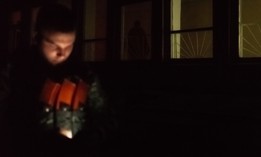 A volunteer of the Kiev territorial defense looks at his phone while waiting to move to a new base on June 2, 2022.